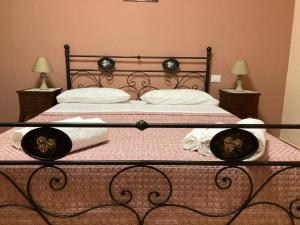 A bed or beds in a room at Agriturismo Tenuta della Madama