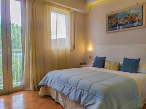 Кровать или кровати в номере Hotel Villa Fiorita