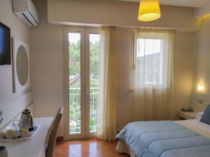 Кровать или кровати в номере Hotel Villa Fiorita