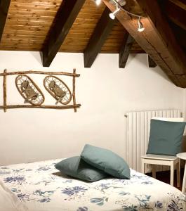 A bed or beds in a room at Enjoy Ledro B&B