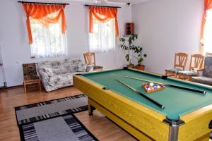 a living room with a pool table in it at U Janusza in Zadwórze +16 photos