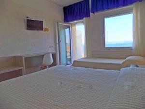 Posteľ alebo postele v izbe v ubytovaní Hotel Diplomatic