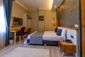 Ένα ή περισσότερα κρεβάτια σε δωμάτιο στο Der Inn Hotel Konyaaltı