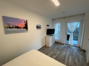 TV a/nebo společenská místnost v ubytování Nici´s Appartements