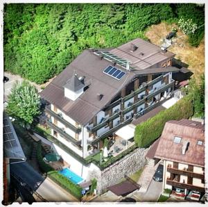 an overhead view of a building with a roof at Chalet Fiocco Di Neve in Pinzolo