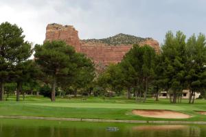 a golf course with a mountain in the background at Bella Diosa 'on the green' in Sedona