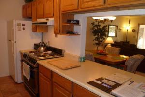 a kitchen with a sink and a stove top oven at Bella Diosa 'on the green' in Sedona