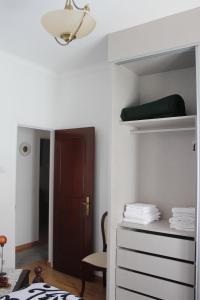 a bedroom with a bunk bed and a closet at Two bedroom apartment, two minutes from the beach in Nazaré