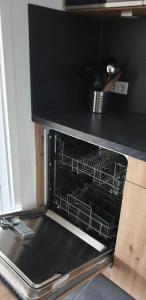 an oven with a dish rack inside of it at Haus am Sonnenberg,Todtnauberg, Ferienwohnung 105, direkt am Skilift-Skipiste, Nähe Feldberg in Todtnauberg