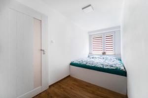 Posteľ alebo postele v izbe v ubytovaní Apartament Paderewskiego 20A