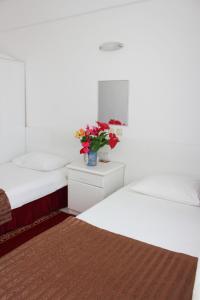 Postel nebo postele na pokoji v ubytování Soykan Hotel