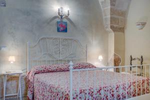 Llit o llits en una habitació de Masseria La Macchiola & Corti del Mito