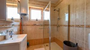 a bathroom with a shower and a sink at Apartments Dario in Medulin +24 photos