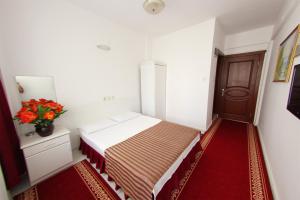 Postel nebo postele na pokoji v ubytování Soykan Hotel