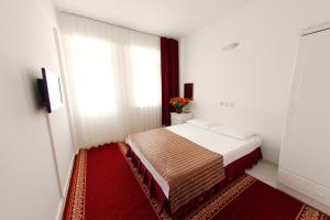 Postel nebo postele na pokoji v ubytování Soykan Hotel