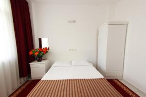 Postel nebo postele na pokoji v ubytování Soykan Hotel