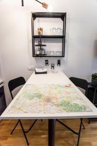 a table with a map on top of it at Loni's Place Apartments in Ljubljana