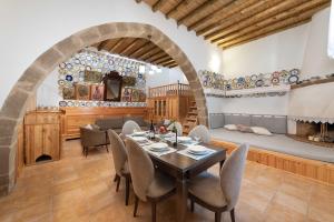 a dining room with a table and chairs at Traditional House Leventis in Archangelos