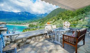 a balcony with a view of a river and mountains at Jennifer Studios in Chrysi Ammoudia