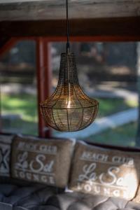 a light hanging from a ceiling in a room at Laawu Kultaa in Kotka