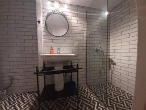 a bathroom with a sink and a mirror at Speri's Loft in Preveza