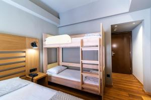 
A bunk bed or bunk beds in a room at Agamemnon Hotel
