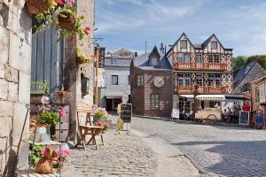 a cobblestone street in a medieval town with buildings at L'évasion - Bungalow 102 in Durbuy