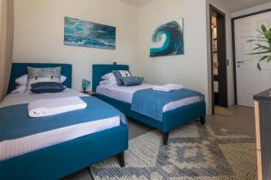 Damari Luxury Retreat Villas Skiathos客房内的一张或多张床位