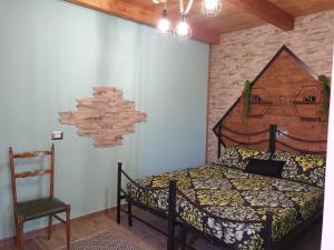A bed or beds in a room at Stanza Del Viggiatore