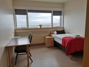 Postel nebo postele na pokoji v ubytování Hotel Mikligardur