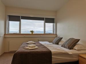 Postel nebo postele na pokoji v ubytování Hotel Mikligardur