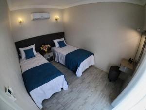 Postel nebo postele na pokoji v ubytování MirAlya Homes