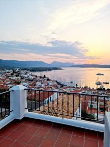 a view of a harbor from a balcony at Panoramic View in Poros