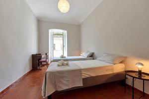 Кровать или кровати в номере Mazzini quarto