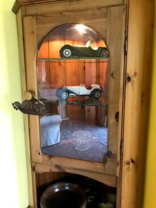 a wooden cabinet with a car in it at Le Cottage in Vinax +32 photos