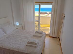 מיטה או מיטות בחדר ב-Seasun Vacation Rentals - BEACH