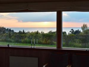 a view of the ocean from a window at 6 person holiday home in F revejle in Fårevejle