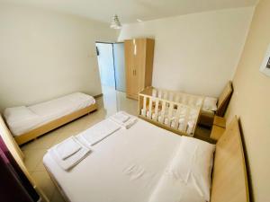 Postel nebo postele na pokoji v ubytování Vila Hotel