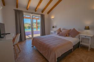 Ένα ή περισσότερα κρεβάτια σε δωμάτιο στο Ares do Monte - Turismo Rural