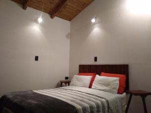 Кровать или кровати в номере El Pueblo Aparts - Rada Tilly