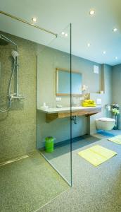 a bathroom with a shower and a sink and a toilet at Fischerstüberl in Ossiach