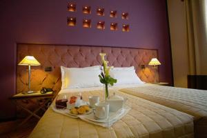 Postel nebo postele na pokoji v ubytování Hotel Messenion
