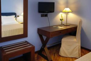 Postel nebo postele na pokoji v ubytování Hotel Messenion