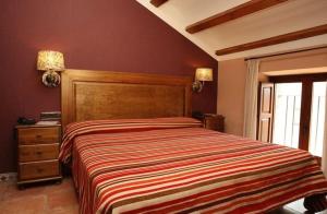 Posteľ alebo postele v izbe v ubytovaní Hotel Con Encanto La Façana