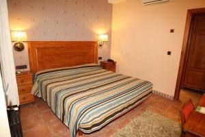 Posteľ alebo postele v izbe v ubytovaní Hotel Con Encanto La Façana