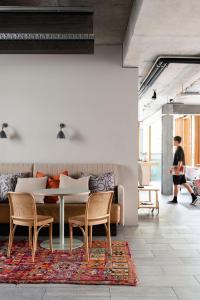 a dining room with a table and chairs at Alex Hotel in Perth