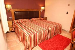 Posteľ alebo postele v izbe v ubytovaní Hotel Con Encanto La Façana