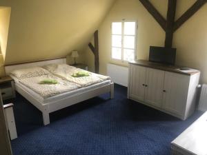 Postel nebo postele na pokoji v ubytování Penzion Modrý Svět