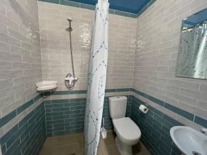 a bathroom with a toilet and a sink at ZAKAT in Zatoka +13 photos