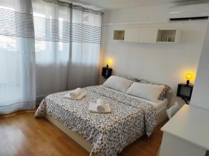 Postel nebo postele na pokoji v ubytování Apartment Leone Umag